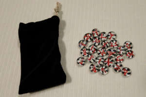 Red on zebra striped Runes with black stretch-velvet pouch.
